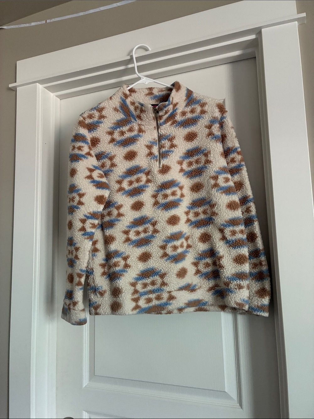 Cozy Cream Fleece Quarter-Zip Sweater with Blue and Brown Pattern